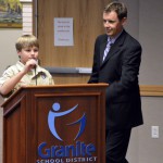 Photo of Boy Scout leading Pledge of Allegiance at board meeting