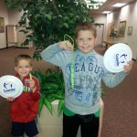 Photo of two students with Play Unplugged prizes