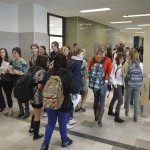 Photo of high school students walking through hallway
