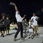 Photo of superintendent throwing t-shirts to Olympus students