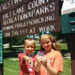 Photo of two students displaying Play Unplugged badges