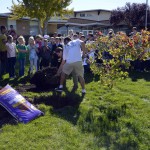 Photo of Arcadia Elementary students planting trees in front of school