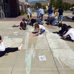 Photo of Wasatch Jr High students drawing with sidewalk chalk