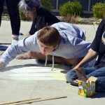 Photo of Wasatch Jr High students drawing with sidewalk chalk
