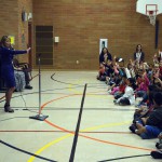 Photo of KSl anchor addressing Beehive Elementary students