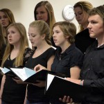 Photo of Cottonwood High Madrigals performing during board meeting