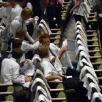 Photo of students taking seats inside Olympus High auditorium