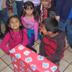 Photo of Orchard Elementary students receiving gifts from Chevron