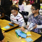 Photo of students opening math lesson materials
