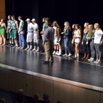 Photo of Olympus High students standing on stage
