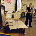 Photo of West Lake teacher speaking to class about WWII soldier's suitcase