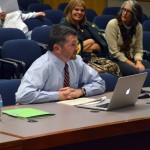 Photo of administrator addressing board of education