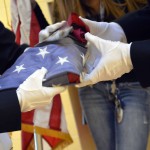 Photo of Taylorsville JROTC members handling American flag
