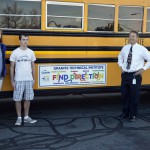 Photo of Bus Ad Contest winners with superitendent
