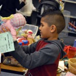 Photo of student picking items from Roosevelt Holiday Store