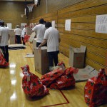 Photo of Vivint employees giving gifts to Lincoln Elementary students