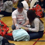 Photo of Vivint employees giving gifts to Lincoln Elementary students