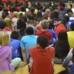 Photo of students sitting during an assembly