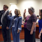 Photo of board members being sworn in to office