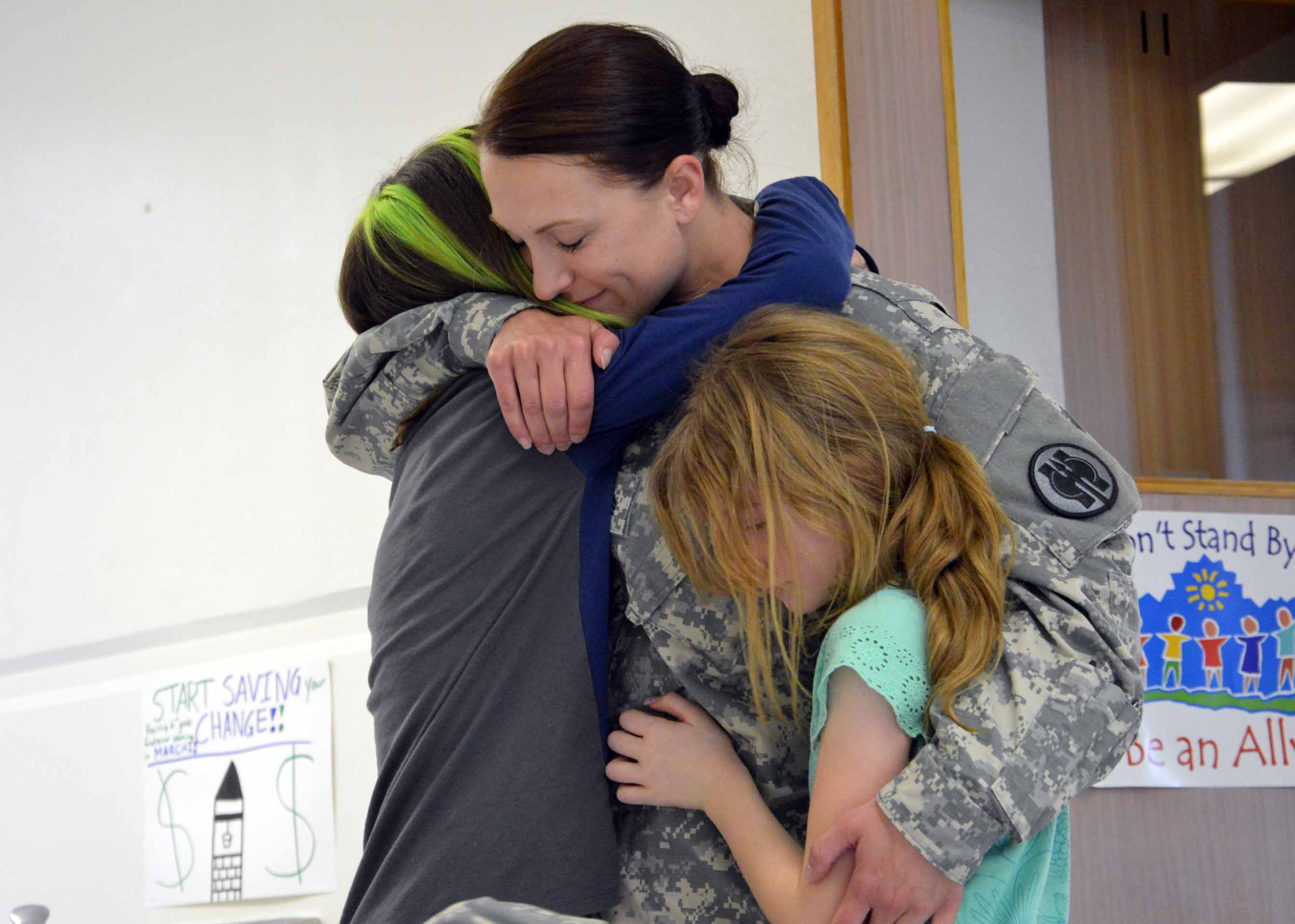 Mom returns from 11-month deployment, surprises two daughters at West Kearns Elementary