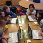 Photo of students learning computer code during Hour of Code event