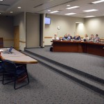 Photo of administrator addressing board of education