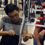 Photo of student working on robot at CTE Open House