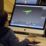 Photo of student exploring graphic design programs at CTE Open House