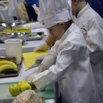 Photo of Future Chefs contestant slicing fruit