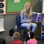 Photo of teacher reading new book to Wilson Elementary students