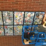 Photo of Granger High mural being installed