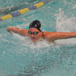 Photo of competitive swimmer in pool lane
