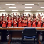 Photo of Neil Armstrong Academy choir singing at board meeting