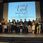 Photo of Excel Award recipients on stage