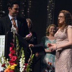 Photo of Excel Award recipient receiving award from sponsor