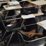 Photo of Hunter High students crouching under desks