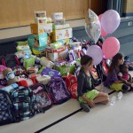 Photo of Oakridge students posing with donated items