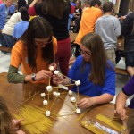 Photo of students building marshmallow tower