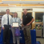 Photo of employee receiving district Wellness award
