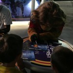 Photo of students getting autographs from Real Monarchs mascot