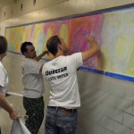 Photo of volunteers painting murals at South Kearns Elementary
