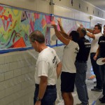 Photo of volunteers painting murals at South Kearns Elementary