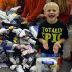 Photo of Elk Run students with pile of donated socks