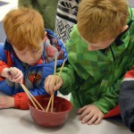 Photo of Twin Peaks students using chopsticks