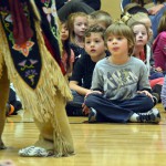 Photo of Native American teacher performing for Oakwood Elementary students