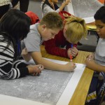 Photo of Vista students marking map of city