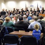 Photo of student choir singing at board meeting