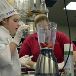 Photo of Future Chefs participant putting ingredients in blender