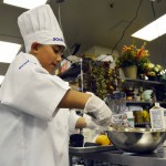 Photo of Future Chefs participant mixing ingredients