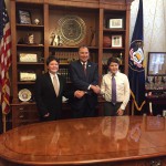 Photo of two Matheson Jr High students shaking hands with Utah governor